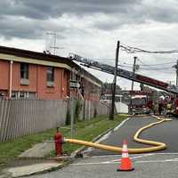 <p>At the scene of the June 12 blaze at the Townhouse Inn and Suites on eastbound Route 46 in Elmwood Park.</p>