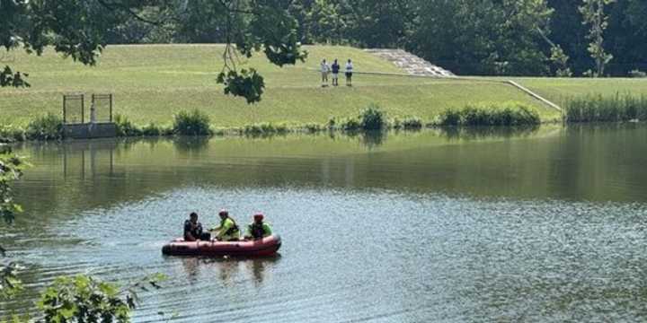 A young fisherman was rescued after being stuck in the mud.