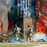 <p>Crews hosing down the fire.&nbsp;</p>