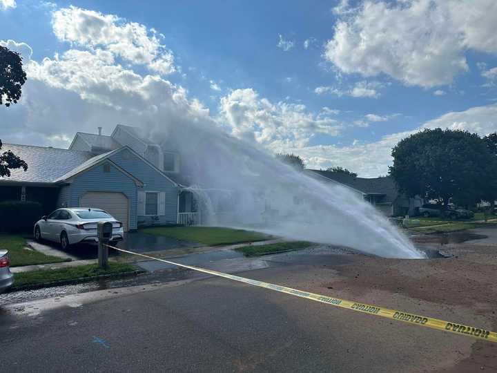 A water main break doused a home with water on Woodbrook Drive in Edison, NJ, on August 12, 2024.