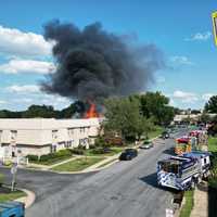 <p>Multiple fire crews getting water to the fire.</p>