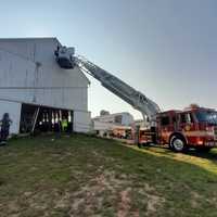 <p>A crane being used to access the barn rafters.&nbsp;</p>