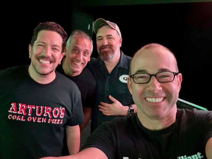 The Impractical Jokers during a 2024 tour.