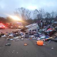 <p>The scene of the explosion with first responder vehicles at the scene.</p>