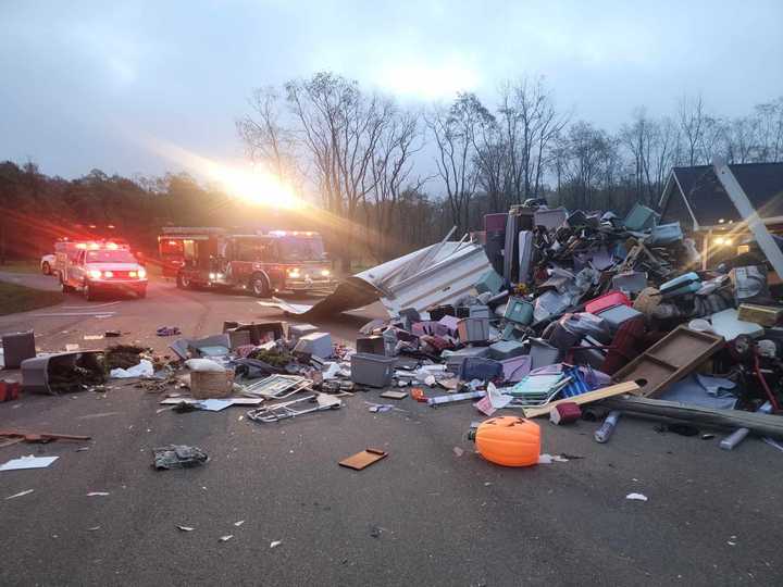 The scene of the explosion with first responder vehicles at the scene.