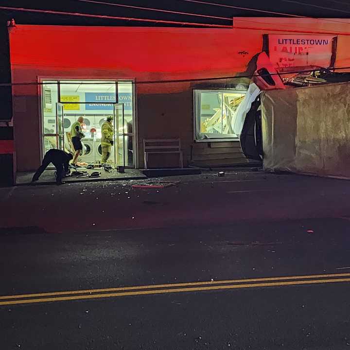 The tractor-trailer rolled over and plowed into the Littlestown Laundromat. 