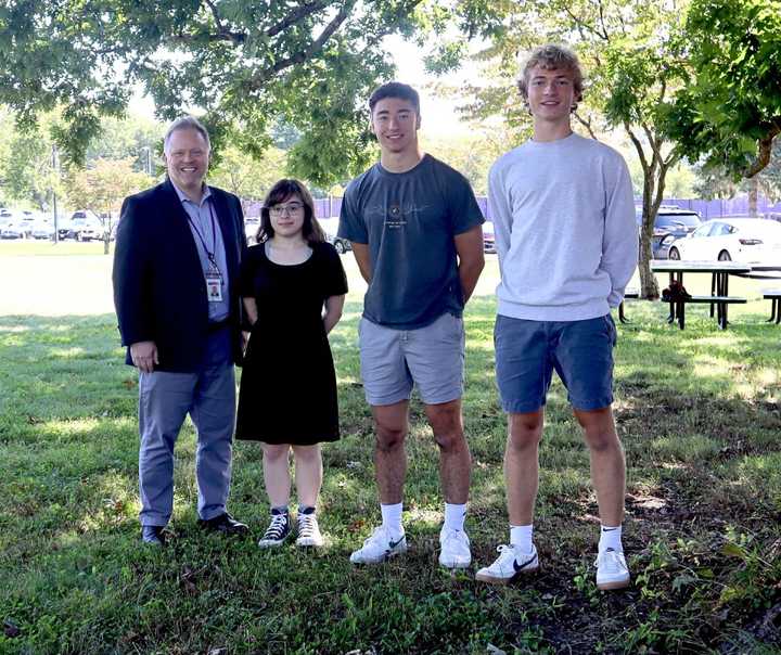 William Harris, Austin Omin, and Nina Vigil pictured with John Jay High School Principal Steven Siciliano.