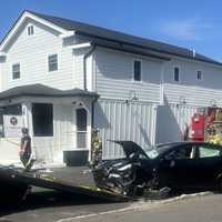 Tesla Driver Suffering Medical Emergency Cuts Across NJ Roadway Hitting Car, Building: Police