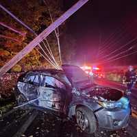 Driver Hospitalized After Car Snaps Poles In Westchester