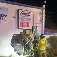 Driver Extricated After Vehicle Crashes Through Route 130 Building In Burlington