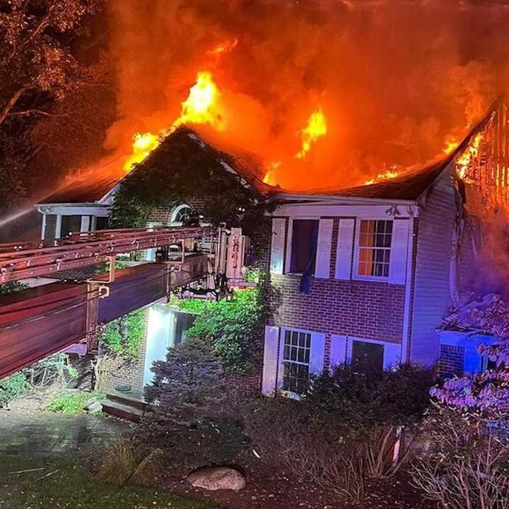 Firefighters battle a three-alarm blaze at 4 Carriage Lane in Ramsay Saturday night, Oct. 12.&nbsp;