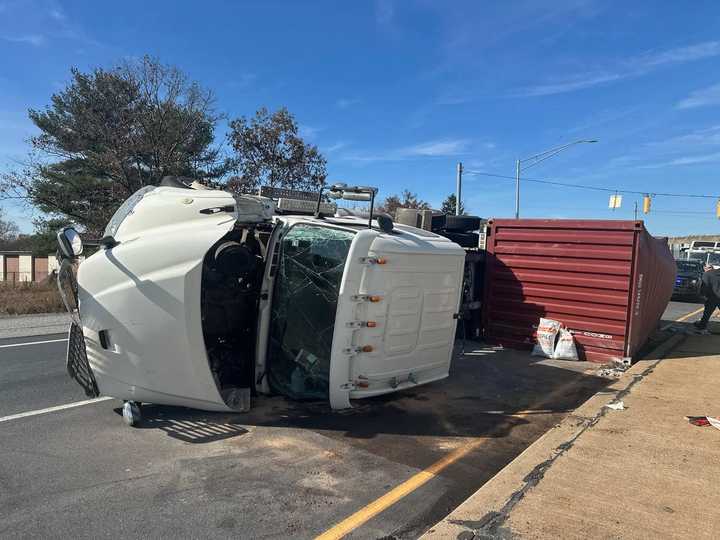 The tractor-trailer flipped on its side at the ramp to the PA Turnpike in Lancaster. 