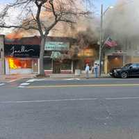 <p>Fire tears through several businesses along Main Street in Sayville on Friday, Oct. 25.&nbsp;</p>