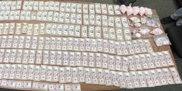 The recovered cash and drugs.