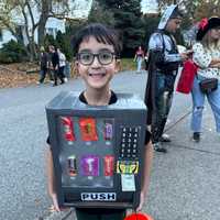 <p>Miles, 11, Fair Lawn, as a vending machine.</p>