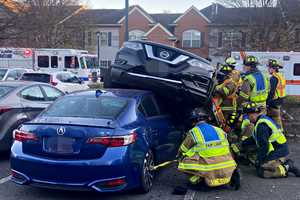 SUV Goes Airborne, Lands On Parked Sedan In Fair Lawn Mishap