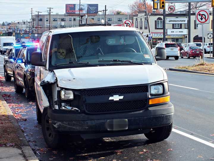 A work van parked at the scene not far from an Elmwood Park patrol car that was apparently involved in a crash.