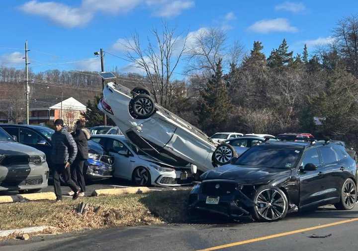 An overturned vehicle landed on top of three cars outside the Bridgewater Diner.