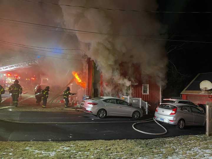 Southington firefighters battle an early morning blaze on Howard Avenue on Thursday, Dec. 26.&nbsp;&nbsp;