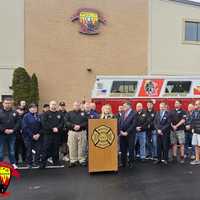 <p>Kayla Masotto speaks at a recognition ceremony held at the Mastic Fire Department on Monday, Dec. 30.</p>