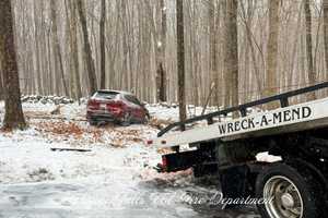 Driver Hospitalized After Car Slides Into Woods In Putnam