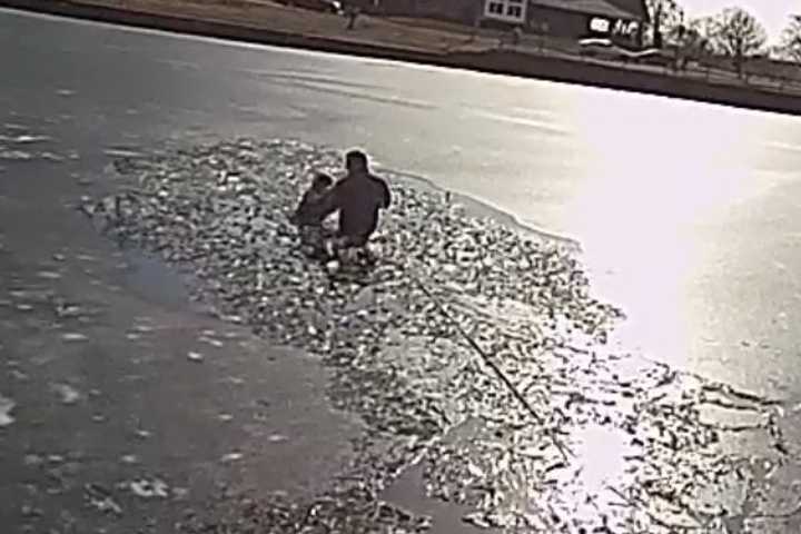 Harrowing Photos Show Officer Saving Boy From Drowning On Icy NJ Lake