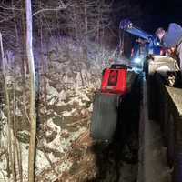 Driver Rescued After Jeep Plunges Onto Railroad Bed: Knowlton Fire