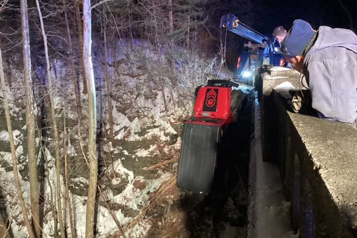 Driver Rescued After Jeep Plunges Onto Railroad Bed: Knowlton Fire