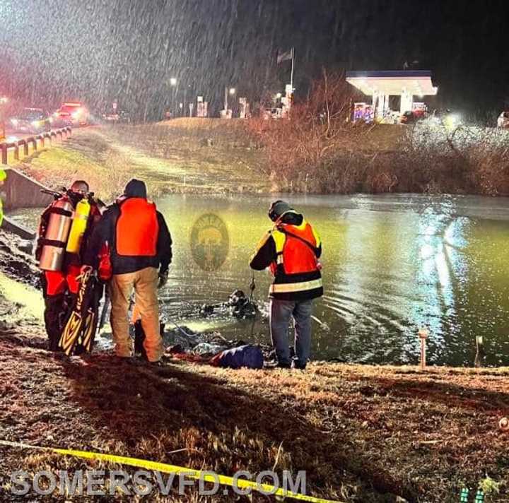 Crews worked to remove the vehicle from the pond. 
