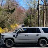 <p>A police car blocks off Glenwood Drive during a barricade Thursday, April 17.</p>