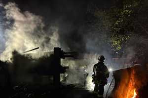Late-Night Fire Engulfs Vehicles, Threatens Train Tracks In New Rochelle