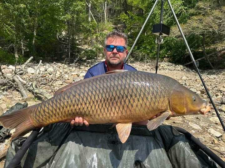 Norbert Samok and his&nbsp;58.05-pound, 44.8-inch carp he caught in Lake Zoar.&nbsp;