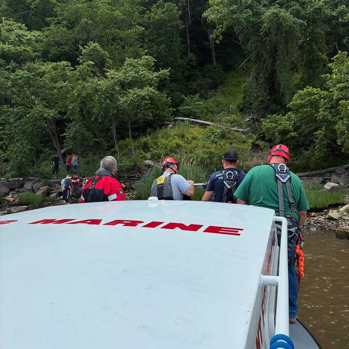 Rescuers approach the stranded hiker in Palisades Interstate Park.