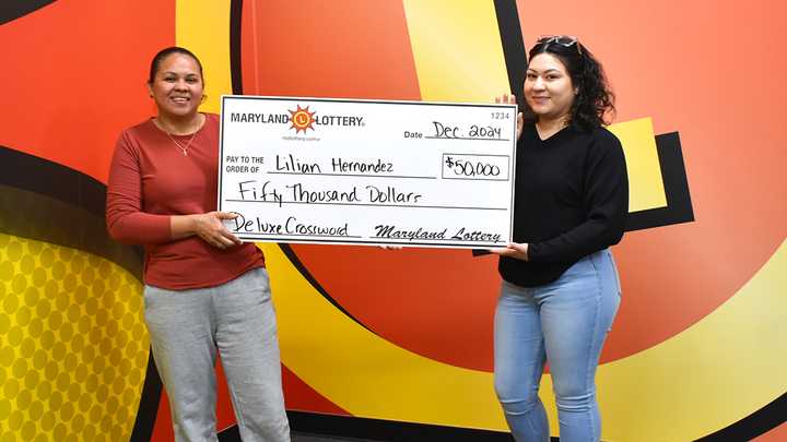 Novice scratch-off player Lilian Hernandez, right, won $50,000 on an instant ticket purchased at the suggestion of her aunt, Norma Hernandez.