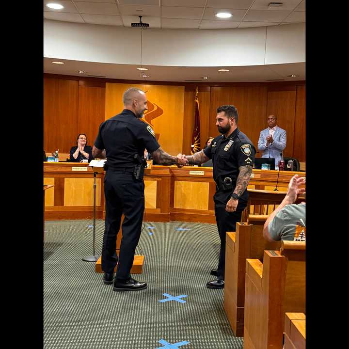 Summit Police Detective Darin Sliker was honored for his heroic actions at a crash scene.