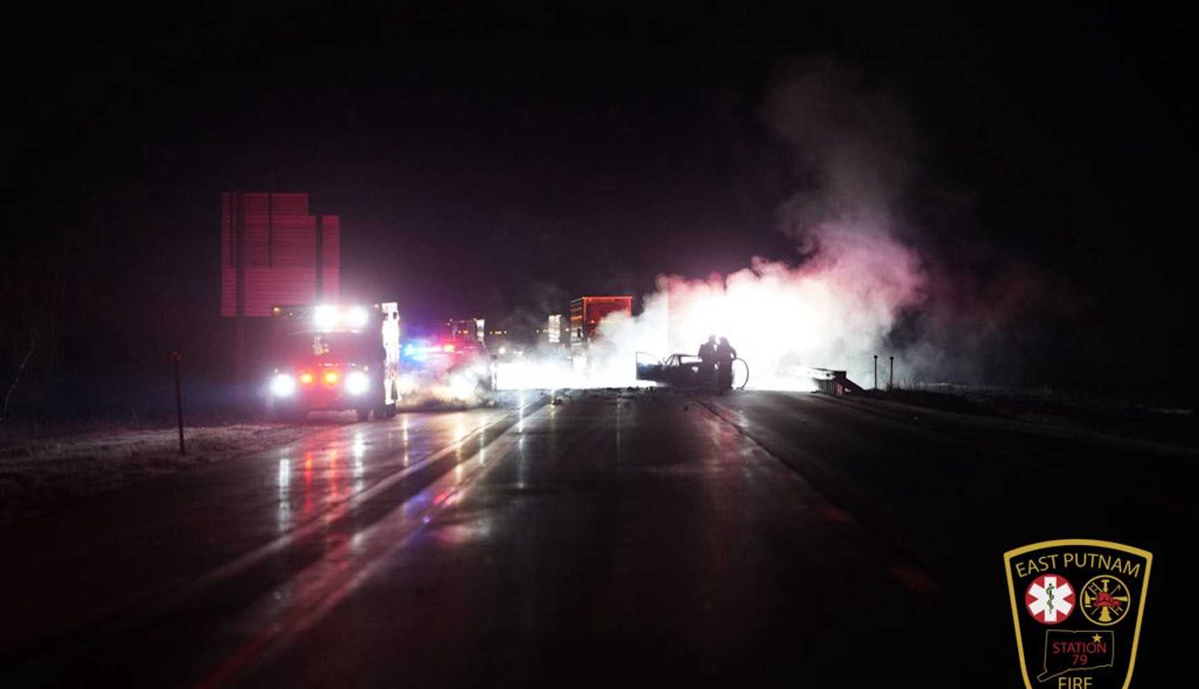 
Firefighters battle a vehicle fire and a tractor-trailer brake blaze after an early morning crash on I-395 in East Putnam. 
