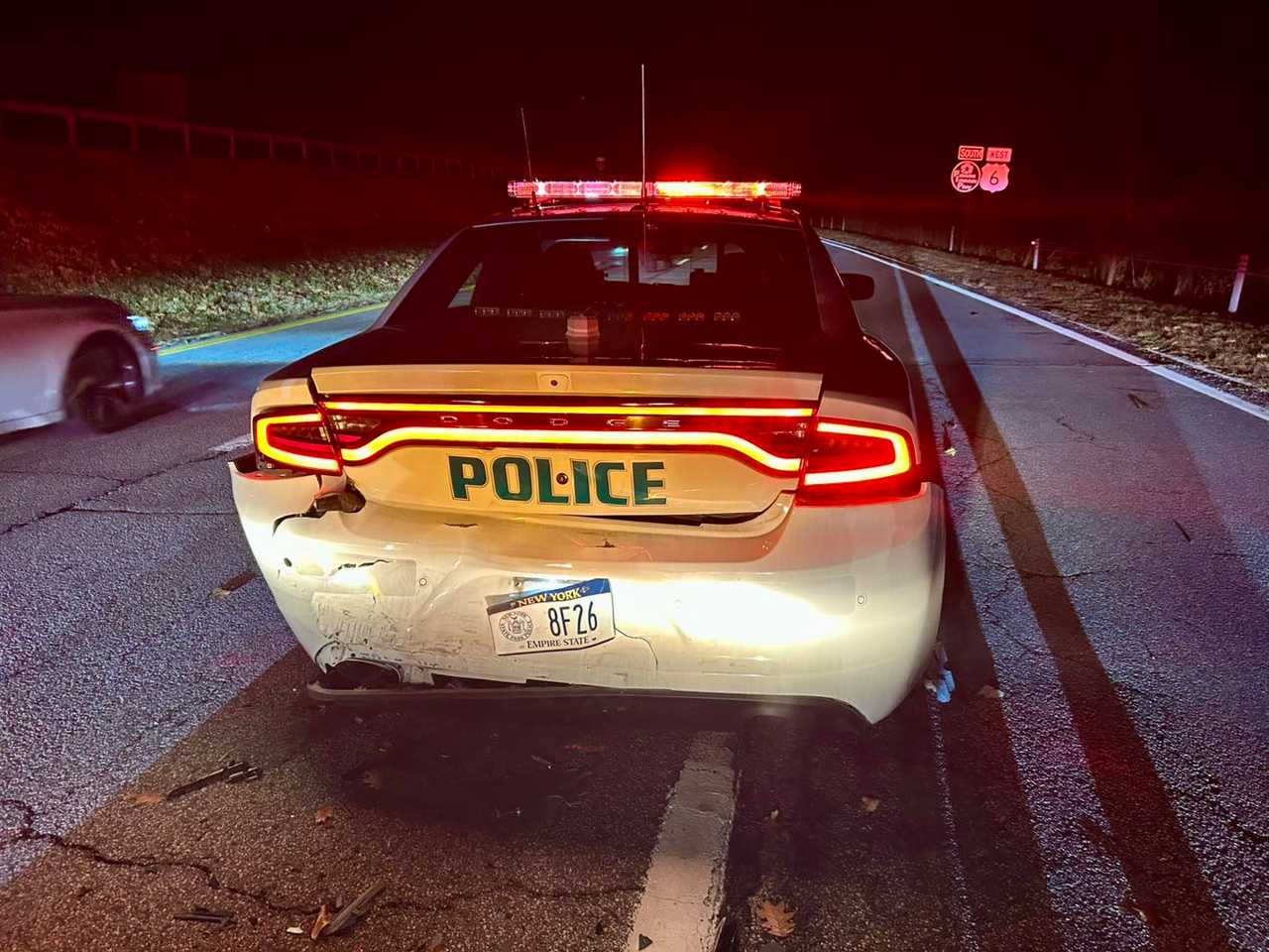 The marked patrol vehicle that was hit. 