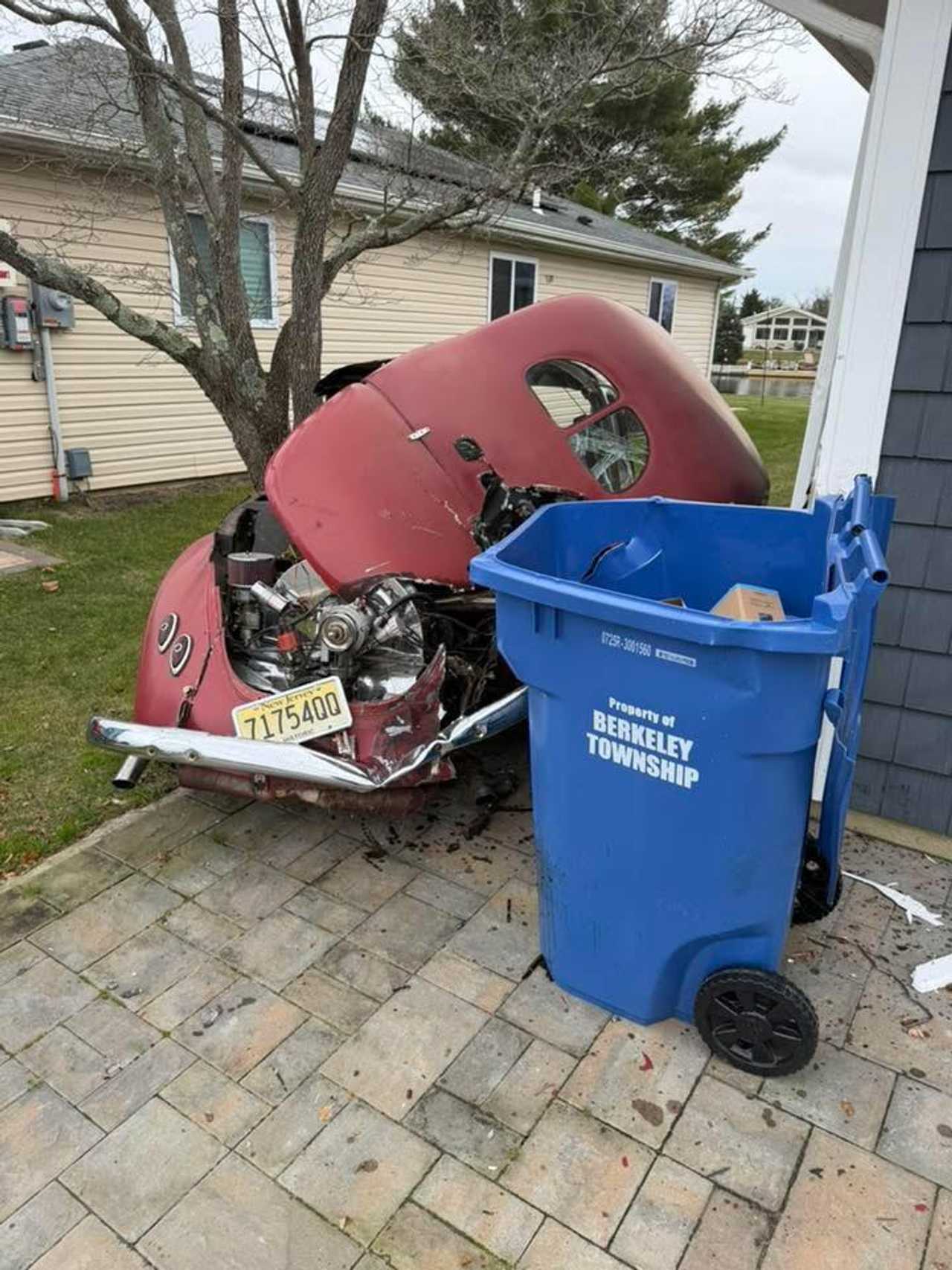 A 2014 Dodge Ram that had crossed the intersection, struck a parked 1969 Volkswagen Beetle, and drove through a garage before entering the living room of the home.