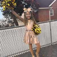 <p>Lianna, 8, of Garfield, as a Cheerleader MVP Trophy.</p>