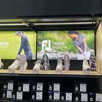 <p>A photo of Miko Page, right, on the wall at Golf Galaxy in Paramus.</p>