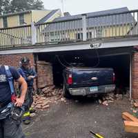Driver Suffering Medical Emergency Crashes Into Norwalk Home, Knocks Out Support Structures