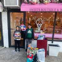 <p>Michael Kearns (7), and&nbsp;Peter Kearns (10) at the Trina's Treats drive on Sunday.</p>