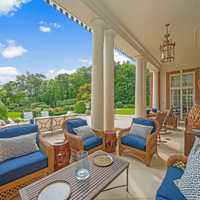 <p>The outdoor patio features views of the rolling property and would be a great place to unwind.&nbsp;</p>