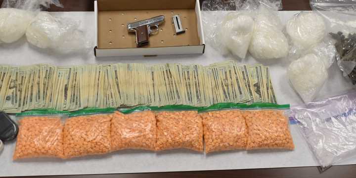 Investigators found eight pounds of meth in crystal and pill form, an illegal handgun, marijuana, drug-selling equipment, and $6,486 during an arrest on Tuesday night, Aug. 20, Troy police said.