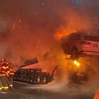 <p>Four of the six cars on the carrier were destroyed in the fire near Exit 14 South.&nbsp;</p>