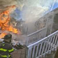 Norwalk Firefighters Save Home from Spreading Blaze in Minutes