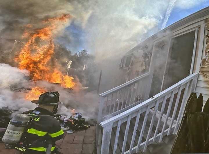 Norwalk firefighters battle a patio fire at 7 Bartlett Manor just after 2 p.m.