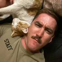 <p>Shane Finnegan and his cat CJ.</p>