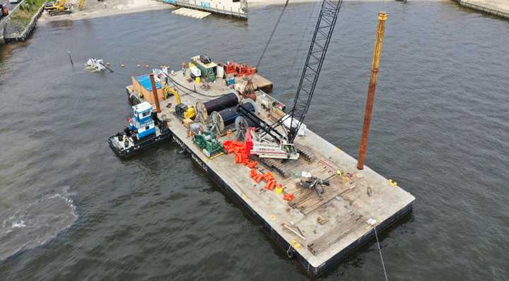 A barge installing underwater transmission lines.