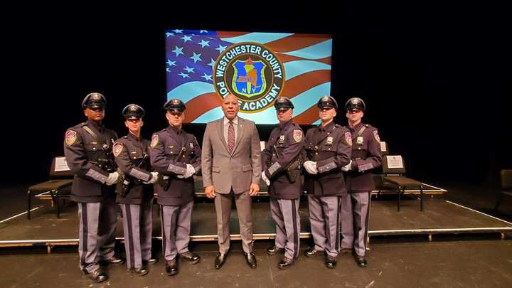 New recruits Shaun Blute, Frank Caparelli, Devin Furphy, Steven Hartog, Autumn Piazza, and Robert Tapia pictured with Westchester Public Safety Commissioner Terrance Raynor.